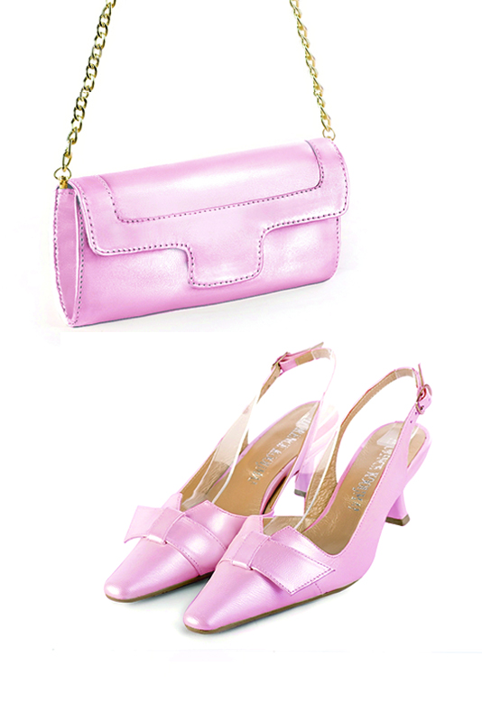 Women's light pink luxurious elegant clutch for ceremonies, weddings and evenings out. - Worn view